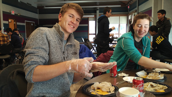 JI students at UM celebrate Thanksgiving with dumpling wrapping